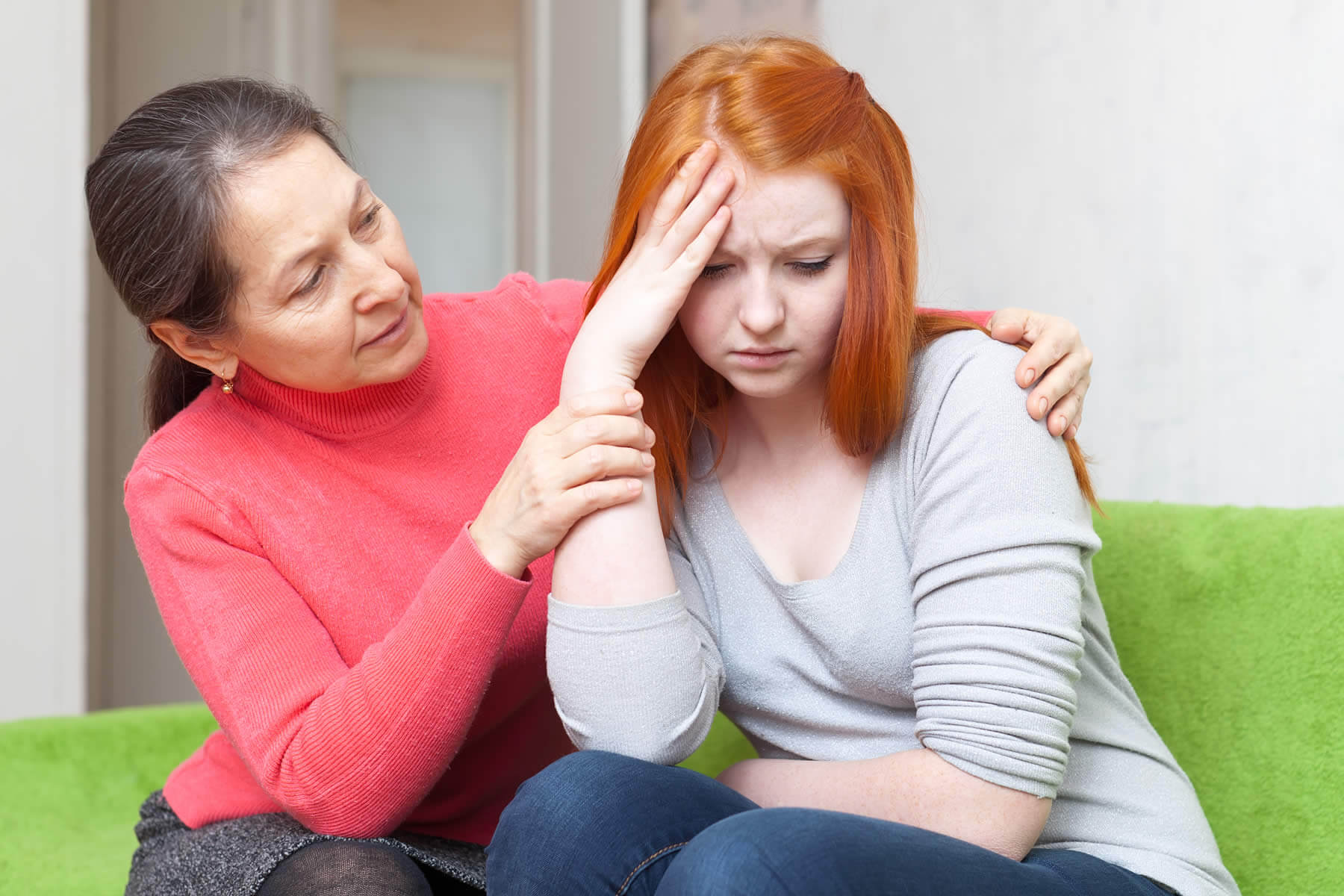 mother consoles her troubled teen